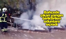 Bahçede çıkan yangın biriktirilen odunlara sıçradı