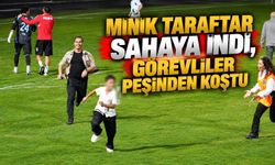 Minik taraftar sahaya indi, görevliler peşinden koştu
