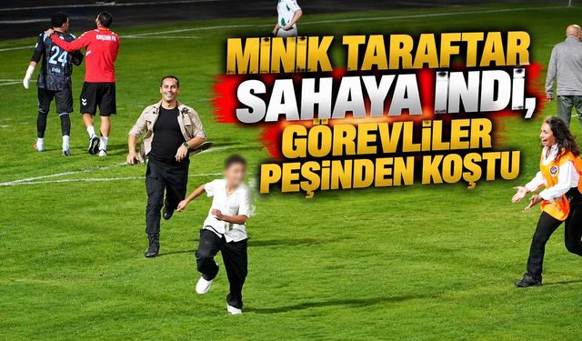 Minik taraftar sahaya indi, görevliler peşinden koştu